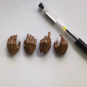 Four bare brown miniature replacement hands, two pairs for 1:6 figures