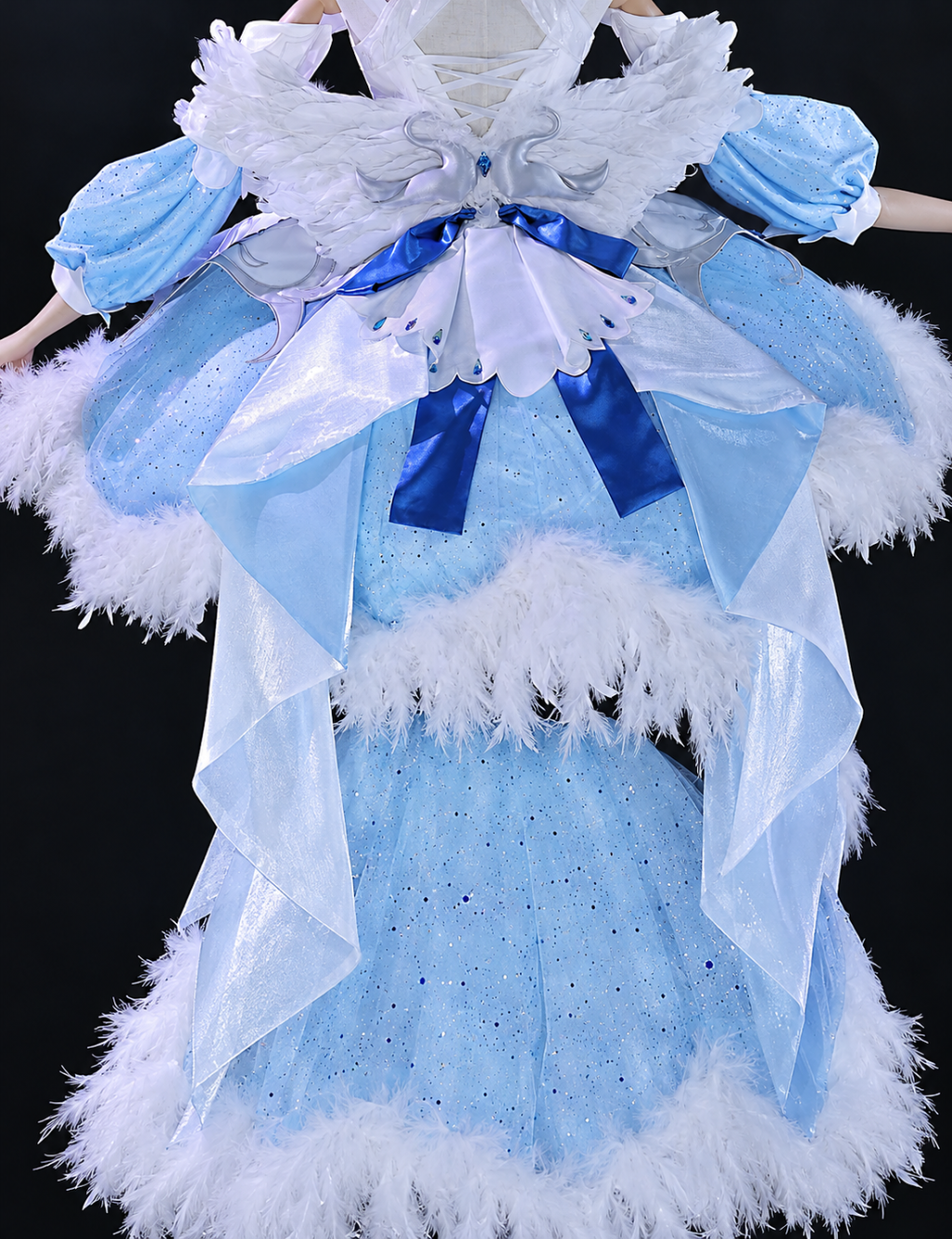 Back of swan costume with feather wings and blue ribbon tails
