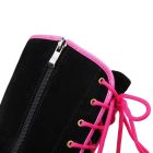 Pink laces and side zipper detail of black wedge boot