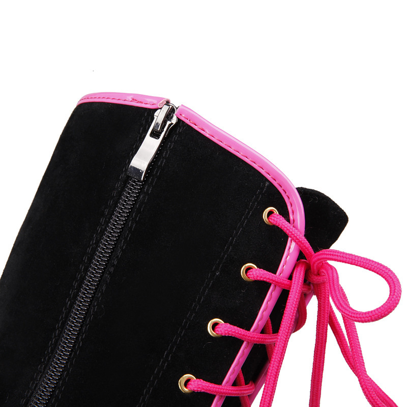 Pink laces and side zipper detail of black wedge boot