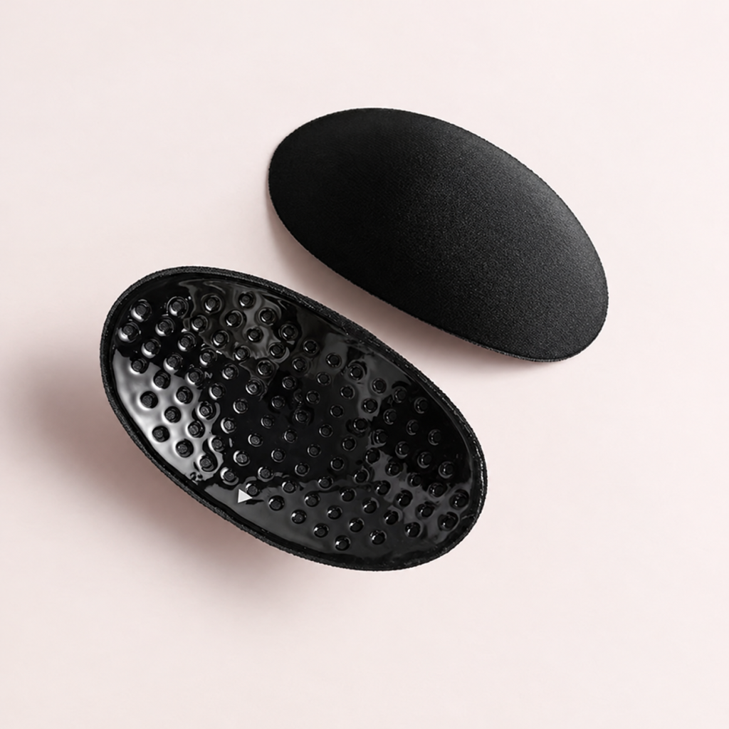 Black ventilated sponge shoulder pad pair, front and underside