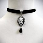 Skeleton cameo frame and black teardrop detail
