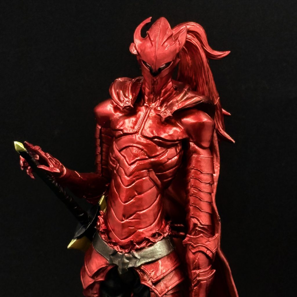 Red Igris figure helmet and layered armor close-up