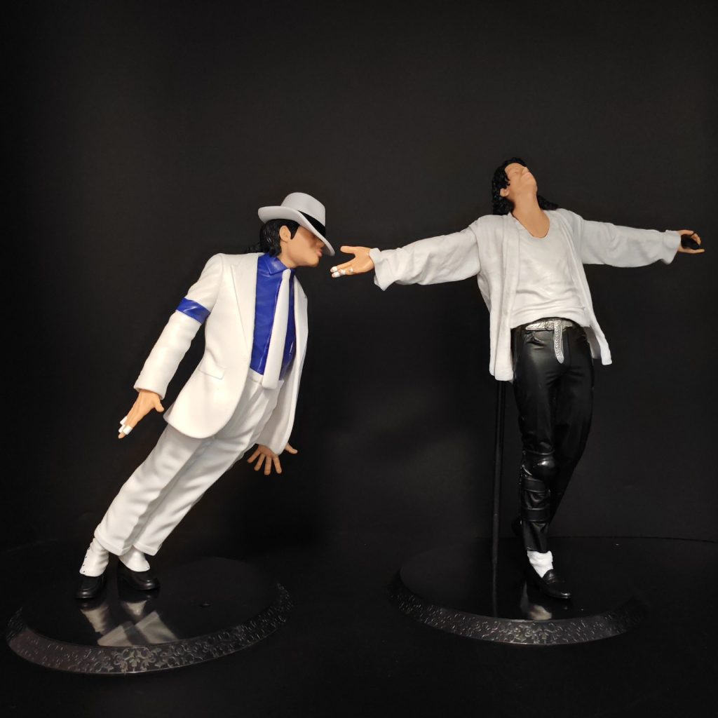 Michael Jackson-inspired tabletop figures in white suit and singing poses