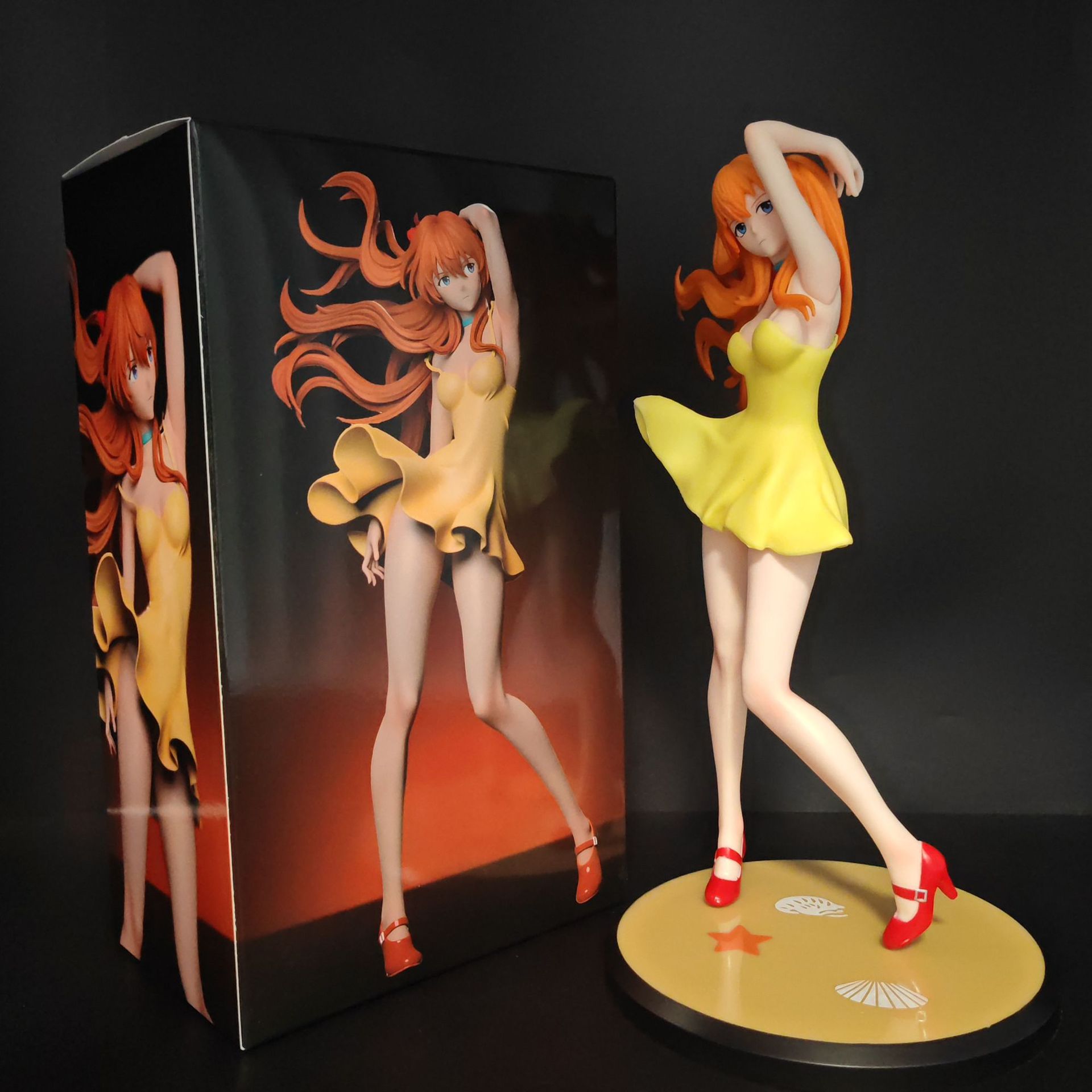 Asuka figurine with yellow display base beside the box