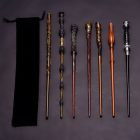 Seven separate wand designs shown next to a drawstring pouch for comparison