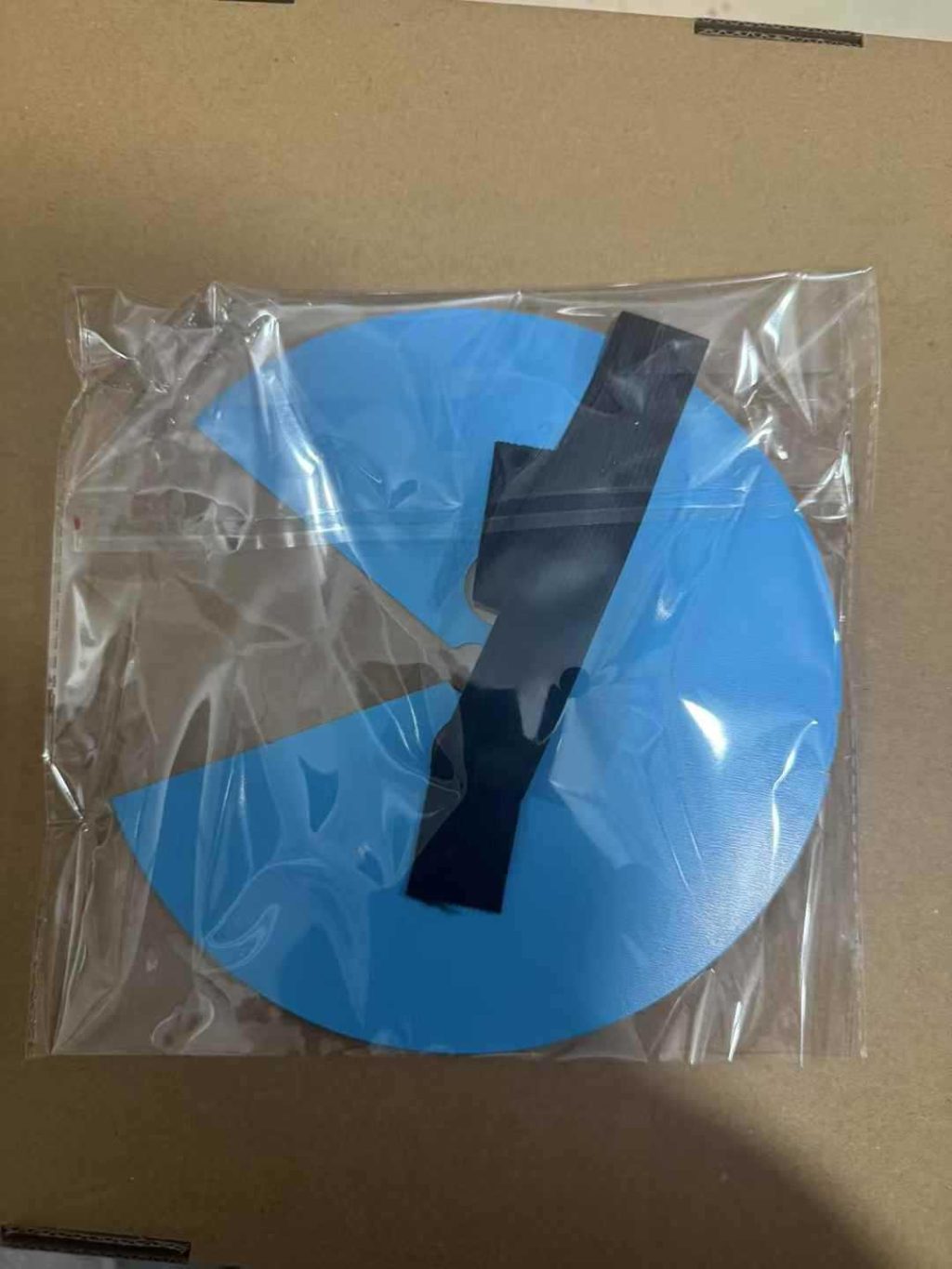 Face prop in clear packaging with blue protective covering
