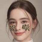 Gold leopard spot face decoration worn on cheeks