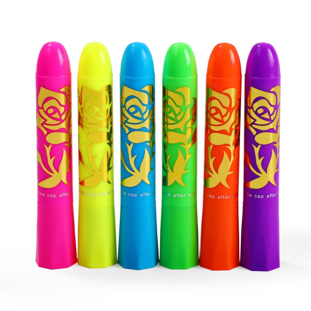 Six capped neon face and body paint sticks in pink, yellow, blue, green, orange and purple