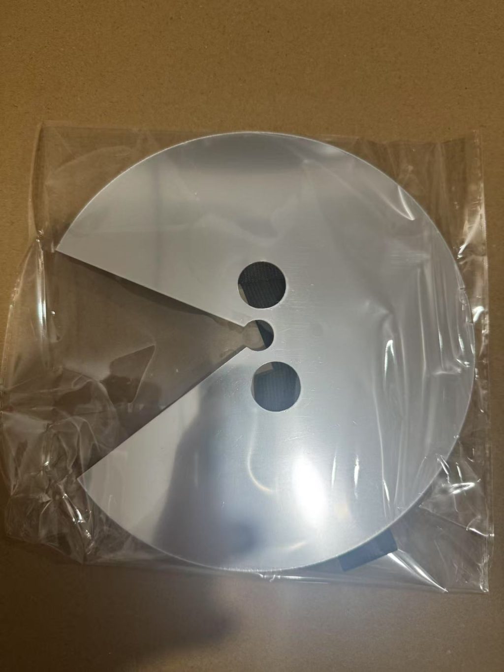 Reverse view of circular face prop and its eye openings