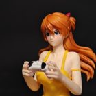 Close view of Asuka figure's blue eyes, orange hair and game controller