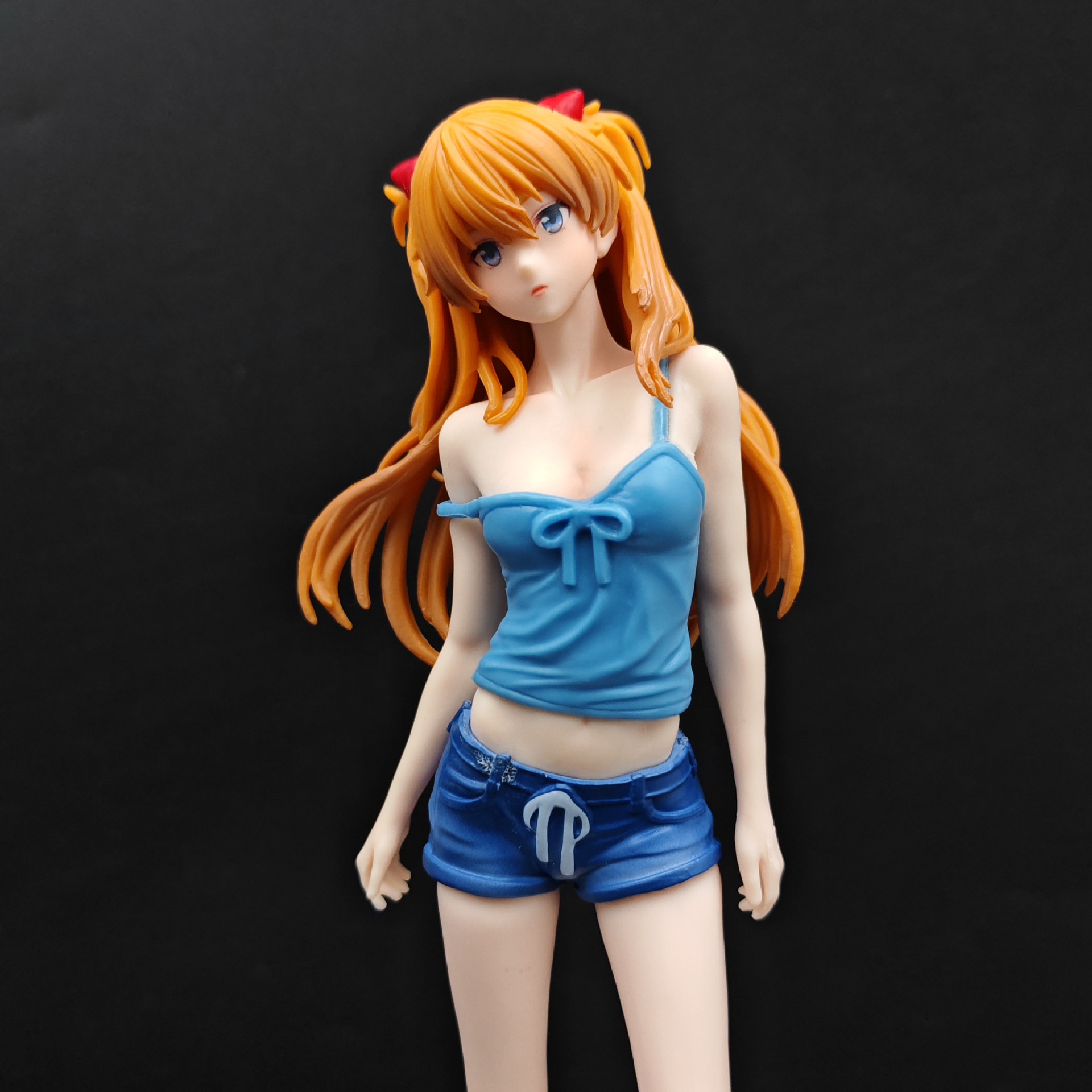 Asuka figure detail with orange hair, blue bow-front top and shorts