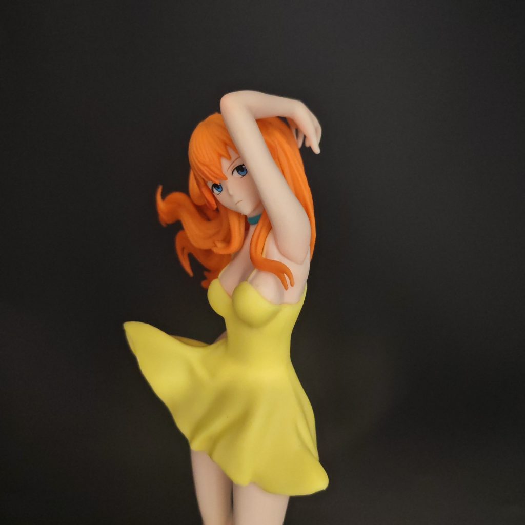 Asuka figurine face, orange hair and yellow dress detail