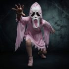 Pink ghost costume and mask in a Halloween scene