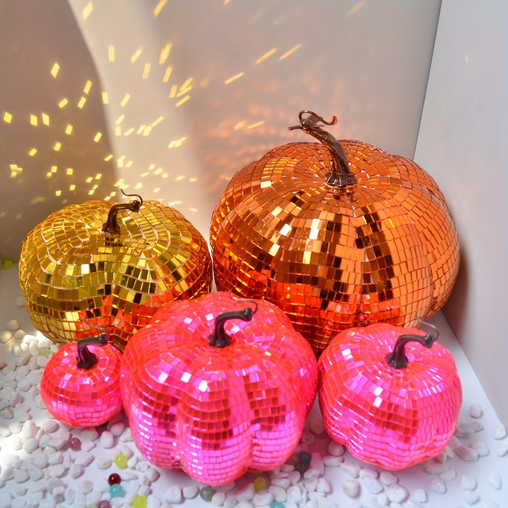 Five pink gold and orange disco pumpkin size choices together