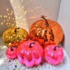 Five pink gold and orange disco pumpkin size choices together