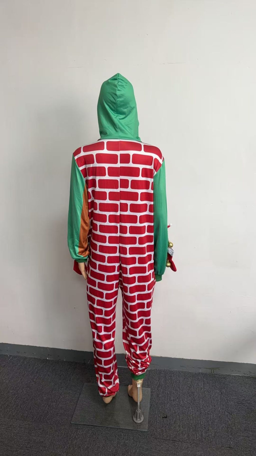 Rear view of fireplace costume with brick-print back