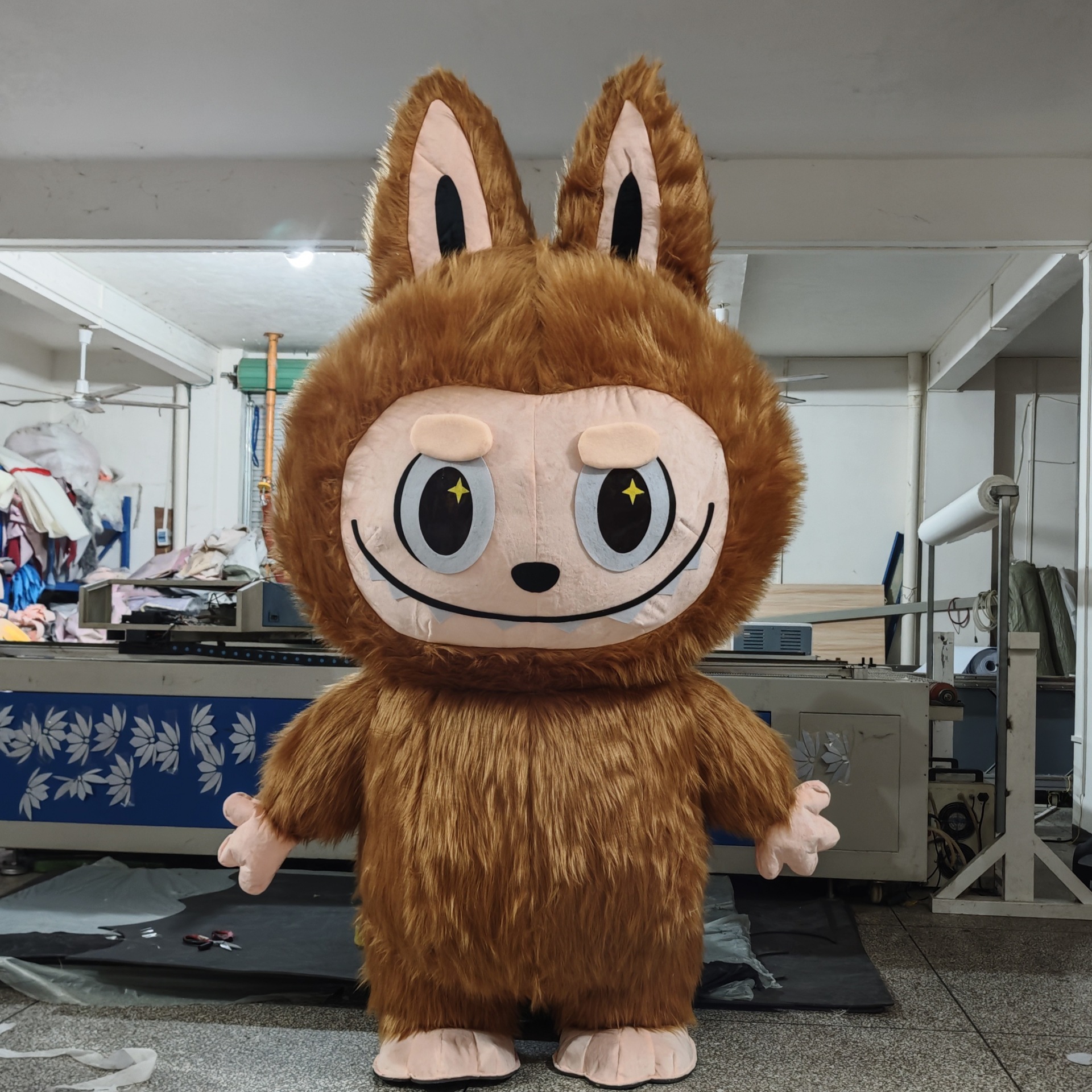 Long ears and toothy face detail of the brown mascot costume