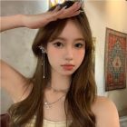 Silver Wing Tassel Ear Cuff Pair — worn position and detail
