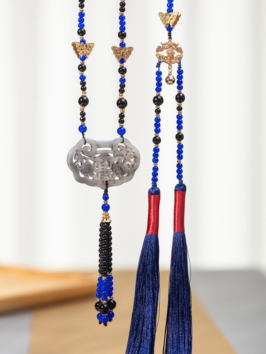 Blue bead necklace openwork pendant and long tassel details
