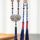 Blue bead necklace openwork pendant and long tassel details