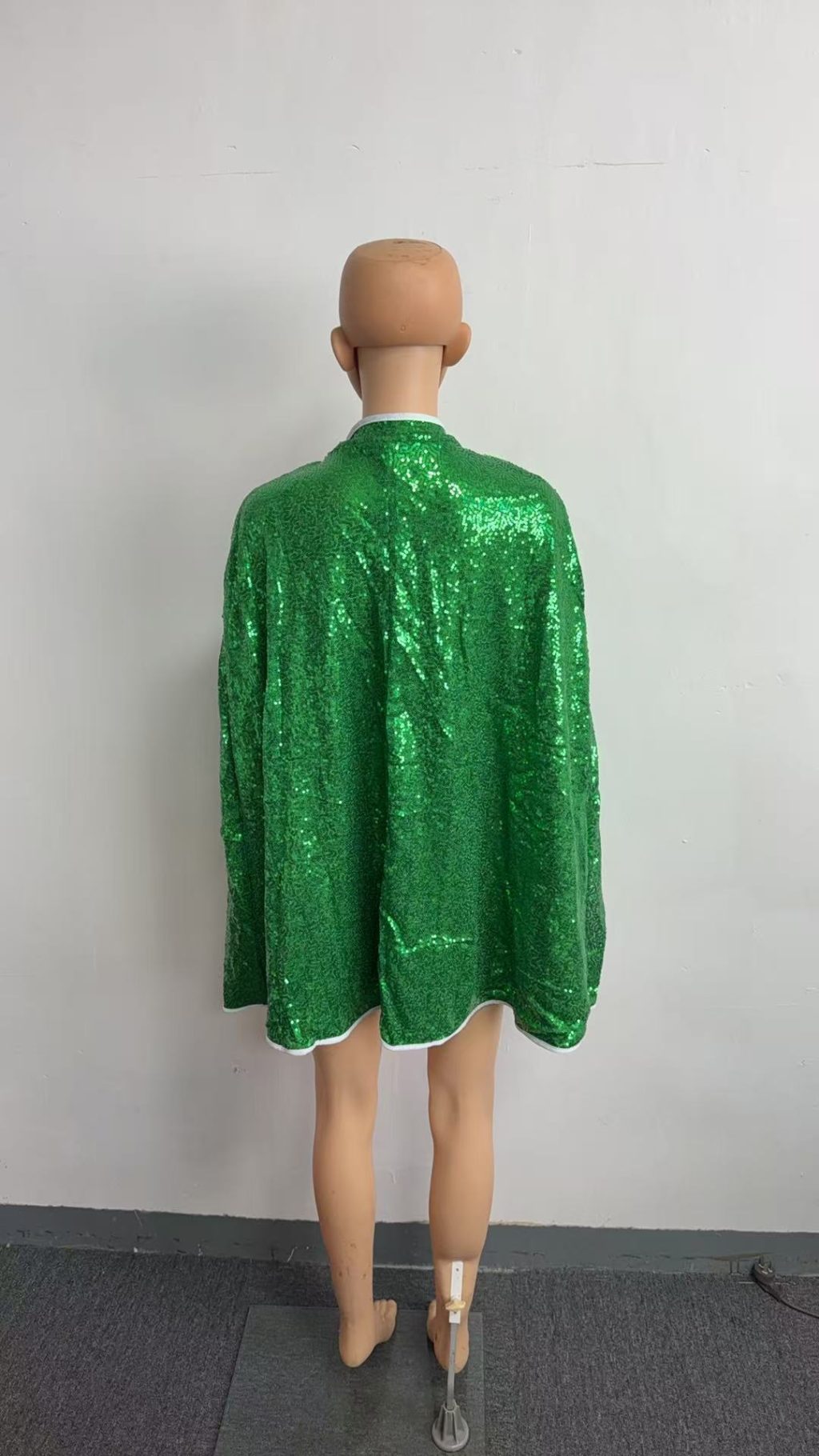 Back view of green sequin cape