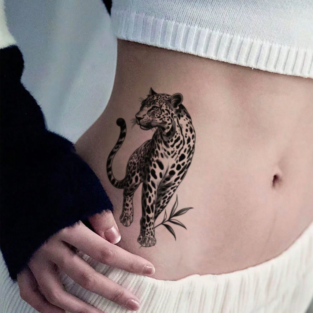 Spotted leopard tattoo shown at waist