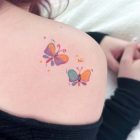 Pastel butterfly transfers shown on a shoulder