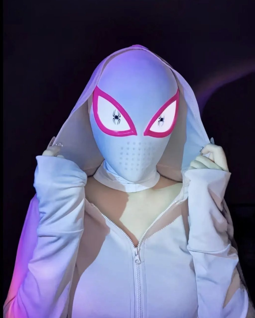 White Gwen-style mask with pink eye frames worn with a web-themed outfit
