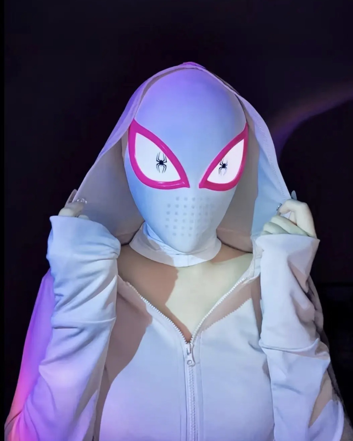 White Gwen-style mask with pink eye frames worn with a web-themed outfit