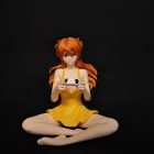 Seated Asuka figure in yellow dress holding a game controller, front view