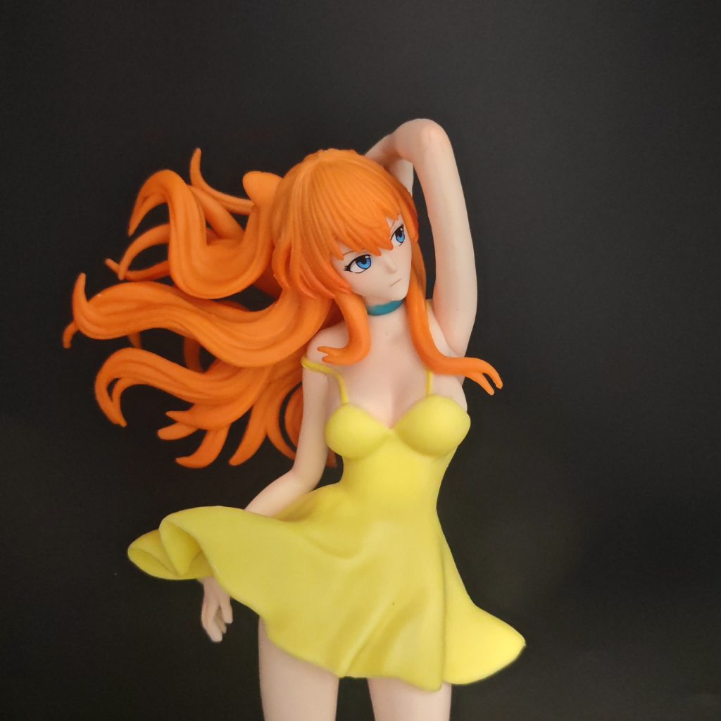 Sculpted orange hair and flared yellow dress detail