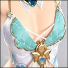 Aqua butterfly-shaped top with gold edging and centerpiece