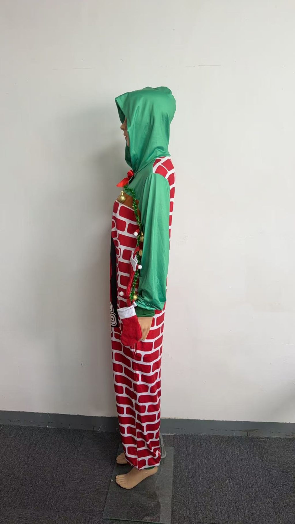 Fireplace costume side view with hanging miniature stockings on sleeve