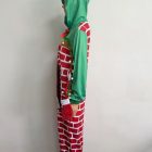 Side view showing green hood and decorated sleeve