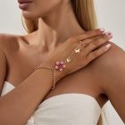 Pink flower and butterfly hand chain with linked finger loop