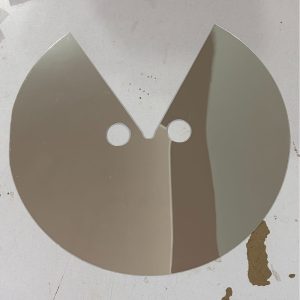 Reflective circular face prop with eye openings and V-shaped lower cutout