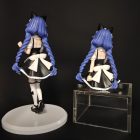 Rear view of the twin braids and bow on both figurine poses