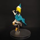 Side and rear view of Coco figurine showing cape folds and pointed hat
