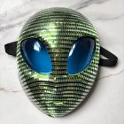 Close-up of blue eye panels, green and silver mosaic pieces, and elastic strap