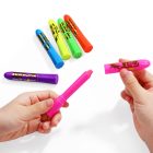 Pink paint stick with cap removed beside the other five neon colors