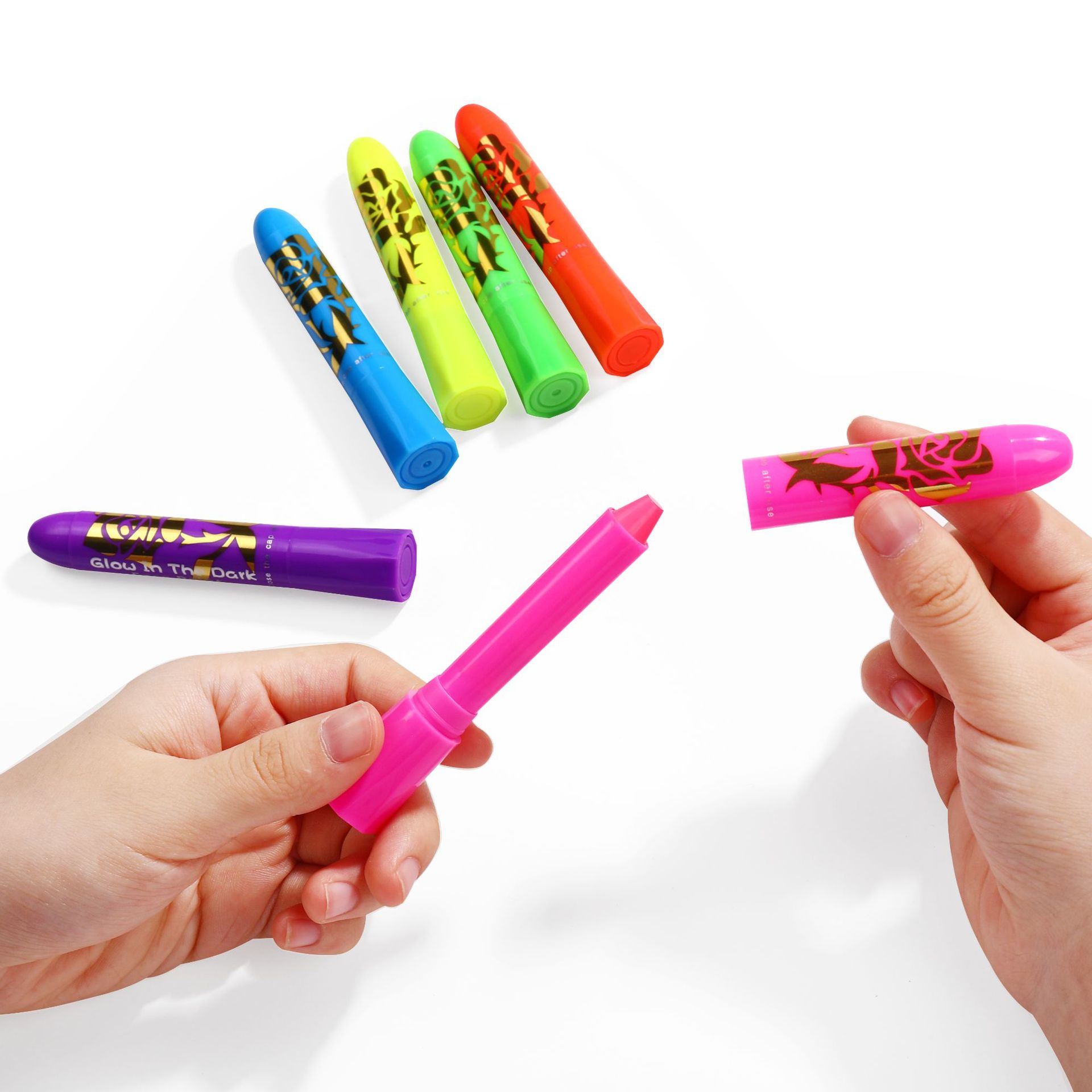 Pink paint stick with cap removed beside the other five neon colors