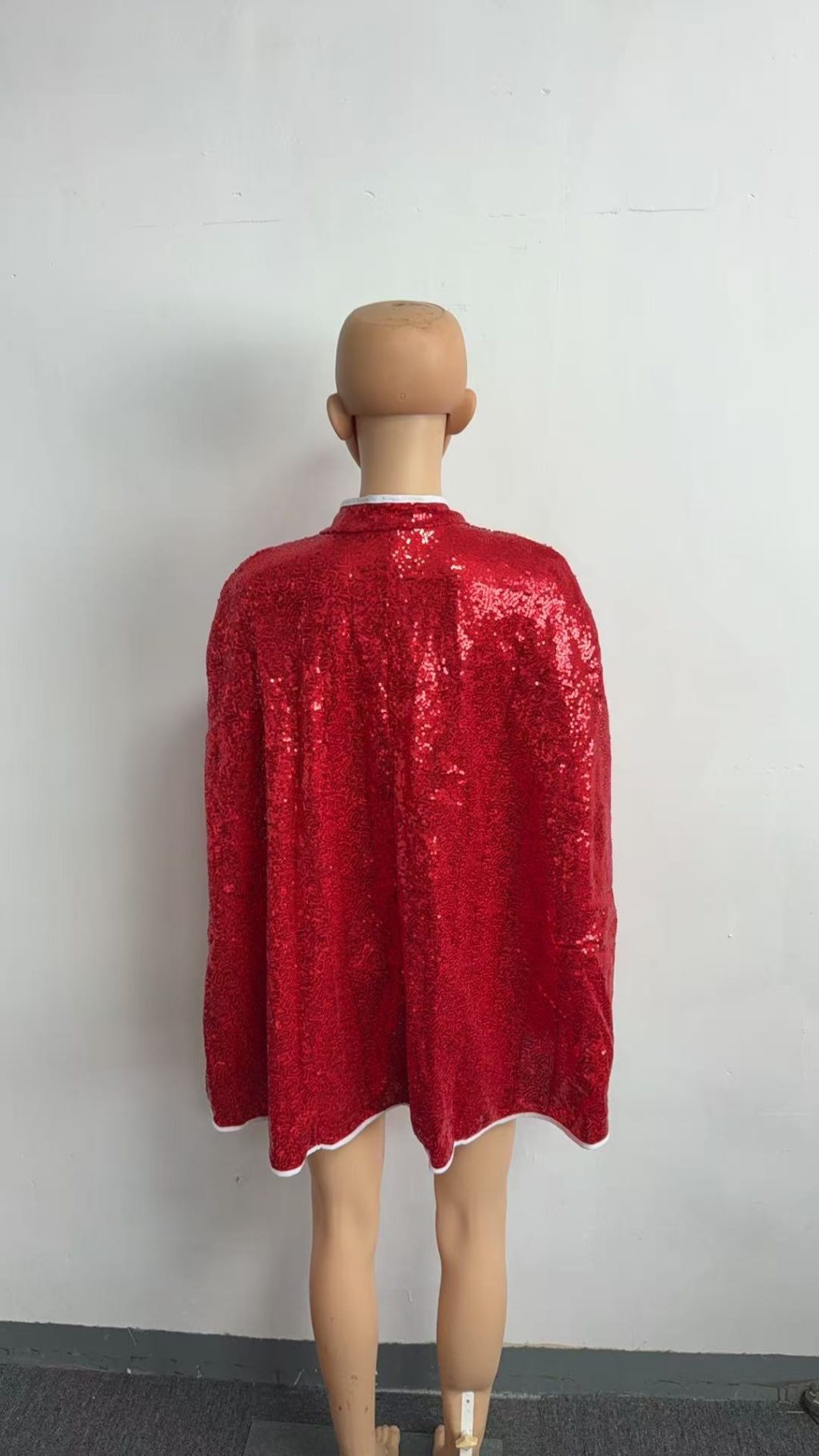 Back view of red sequin cape