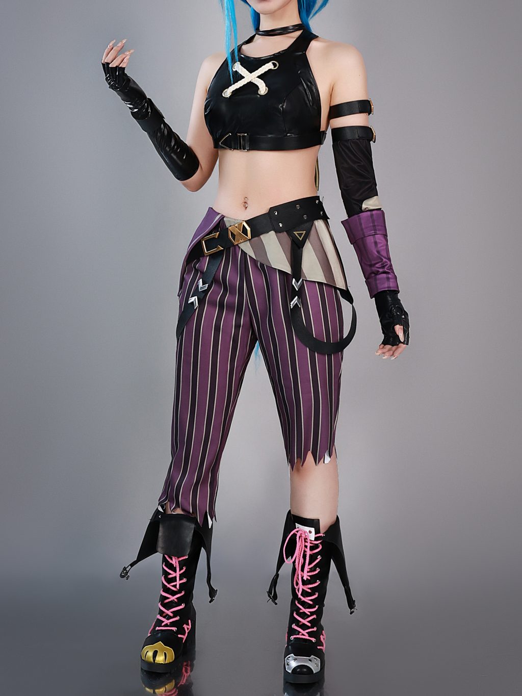 Jinx costume with black cross-front top and purple striped pants, front view