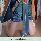 Close view of teal Little Zombie Miku dress and hanging sash