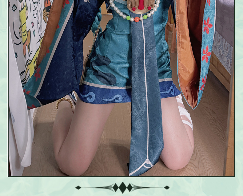 Close view of teal Little Zombie Miku dress and hanging sash