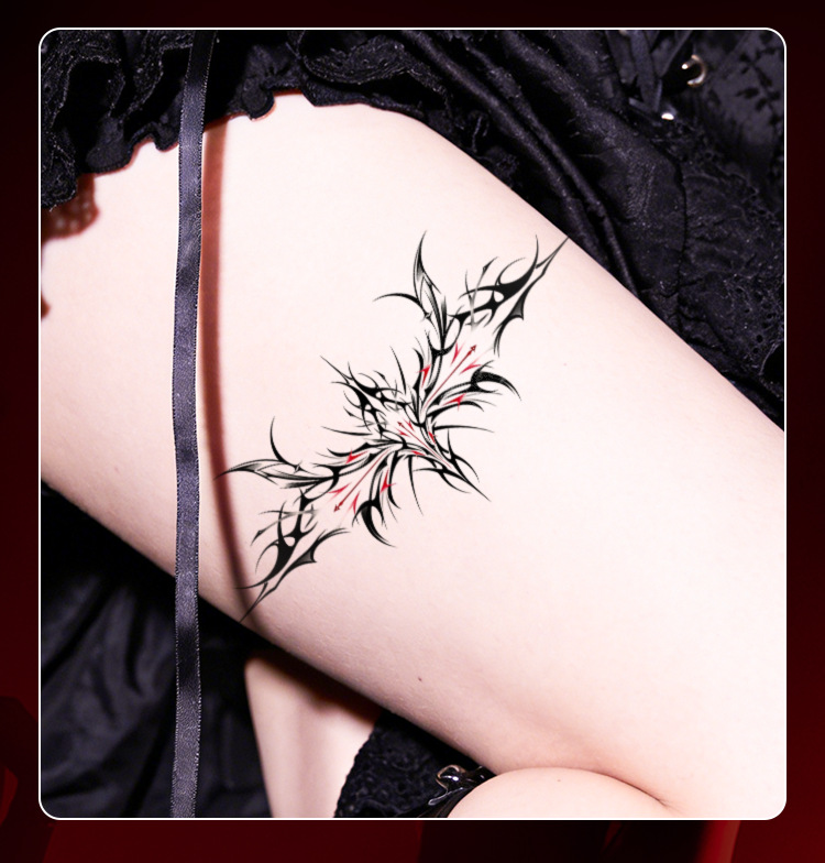 Dark Wing And Heart Temporary Tattoo Sheets – 12 Motifs And Packs 14 Black and red thorn tattoo worn on thigh