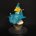 Rear view of Coco figurine showing swept teal cape, blonde hair and display base