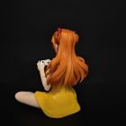 Rear three-quarter view of Asuka figure in a yellow dress