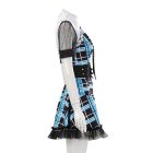 Side view showing the flared blue plaid skirt and sheer sleeve